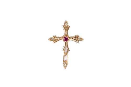 A ruby and white topaz cross in 9 carat yellow gold