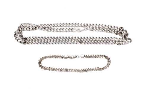 A curb link necklace and bracelet in sterling silver.