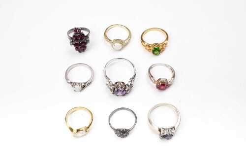 A collection of nine rings in sterling silver