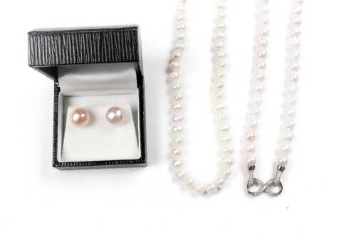 Two strands and a pair of earrings with freshwater pearls