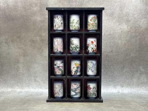Set of twelve Franklin Porcelain tea cups in stand