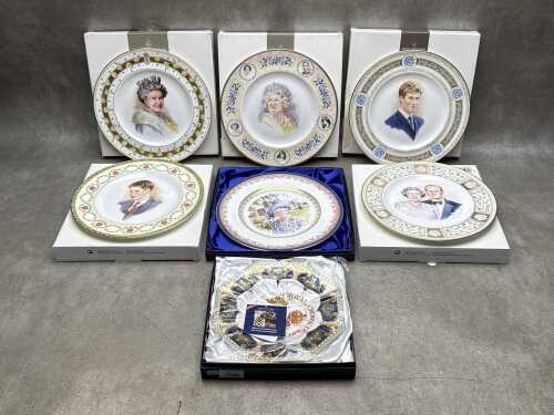 Six Royal Doulton British Royal Family commemorative porcelain cabinet plates, plus one Crown Derby