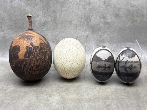 Three decorative eggs, together with a carved Boab nut