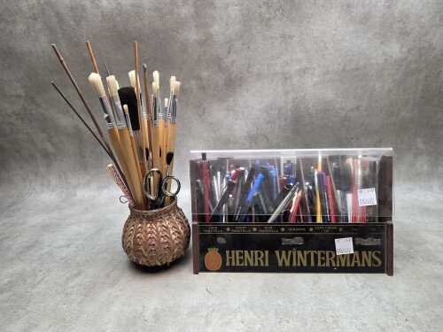 Henri Wintermans cigar display box containing various pens and pencils