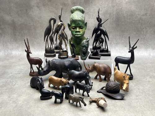 Carved figures, mostly animals, including horn and timber