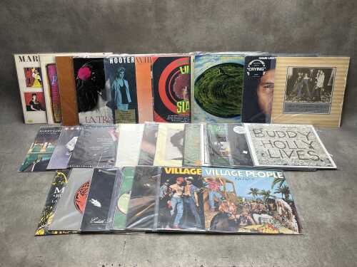 Thirty vinyl records, mostly Rock and Pop