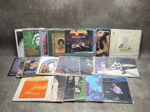 Thirty vinyl records, mostly Rock and Pop