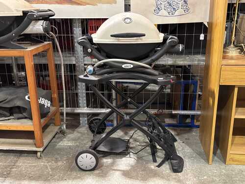 Weber Q1200 gas barbecue with portable cart
