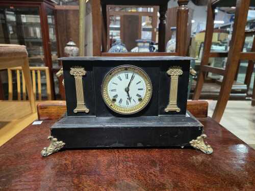 Antique cast-iron mantel clock