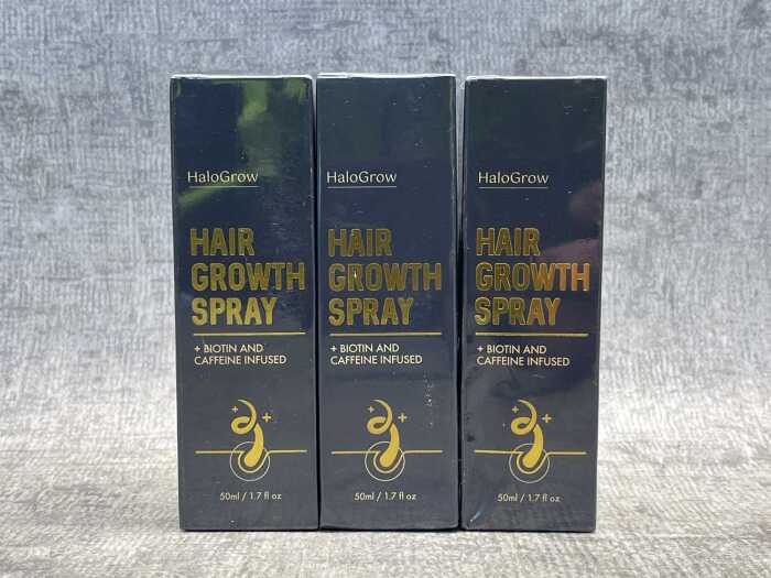 Three cans of HaloGrow Hair Growth Spray