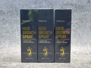 Three cans of HaloGrow Hair Growth Spray