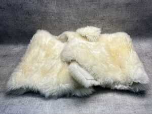 Two Ugg Australia sheepskin rugs
