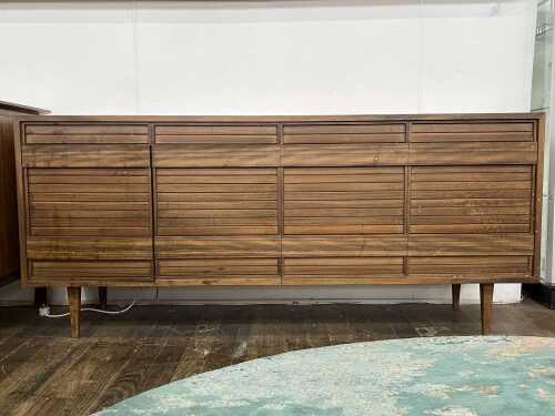 13 · An ingenious mid-century walnut sideboard and stereo cabinet