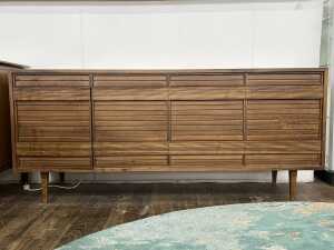 An ingenious mid-century walnut sideboard and stereo cabinet