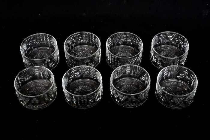Eight Oiva Toikka for Nuutajarvi 'Flora' clear glass bowls