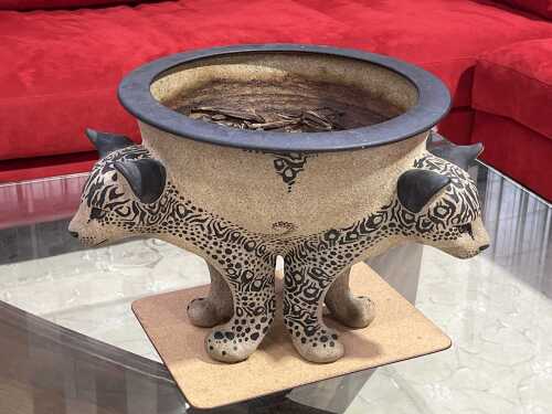 Pottery planter with three figural jaguar supports