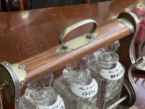 Antique timber tantalus with cut crystal decanters, brass fittings and key - 3