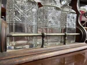 Antique timber tantalus with cut crystal decanters, brass fittings and key - 4