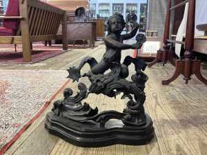 Antique cast metal figure of a twin tailed Triton or merman