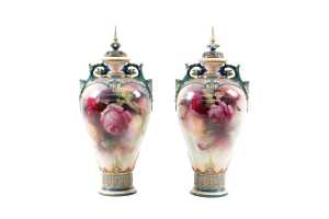 Pair of Edwardian Royal Worcester Hadley Ware porcelain urns decorated by C.V. White