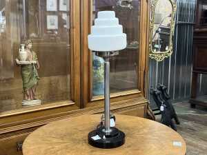 Art Deco table lamp with stepped milk glass shade