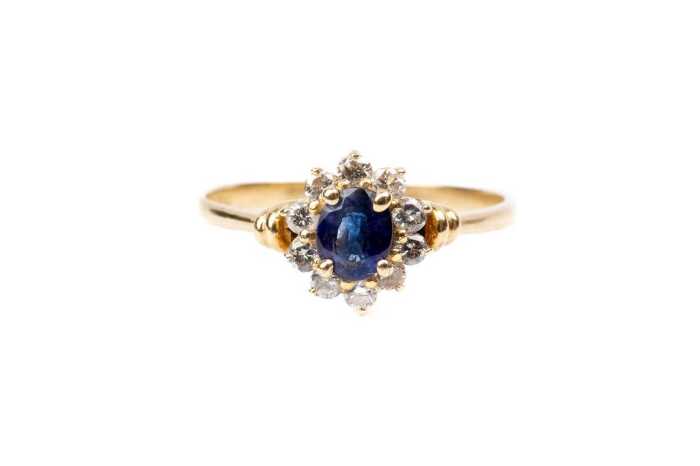 A sapphire and diamond ring in 18 carat yellow gold