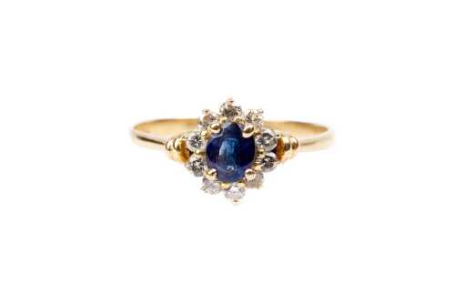 A sapphire and diamond ring in 18 carat yellow gold