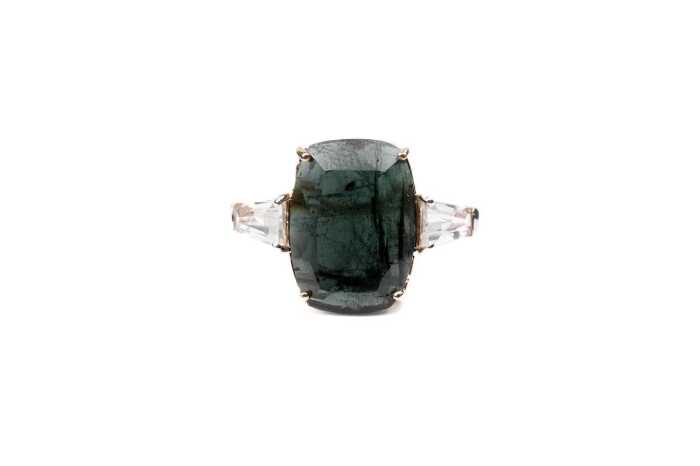 A green tourmaline and white topaz ring in 9 carat yellow gold