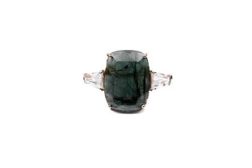 A green tourmaline and white topaz ring in 9 carat yellow gold