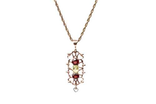 A garnet and peridot pendant and necklace in 9 carat yellow gold