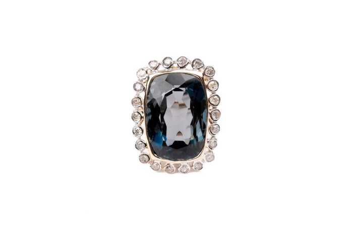 A London blue topaz and diamond ring in 14 carat yellow gold