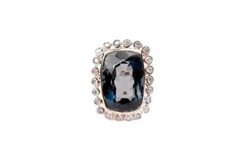 A London blue topaz and diamond ring in 14 carat yellow gold