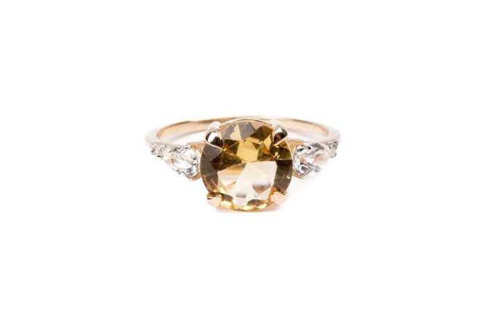 A citrine, white topaz and diamond ring in 9 carat yellow gold