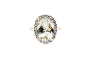 A green amethyst and diamond ring in 9 carat yellow gold