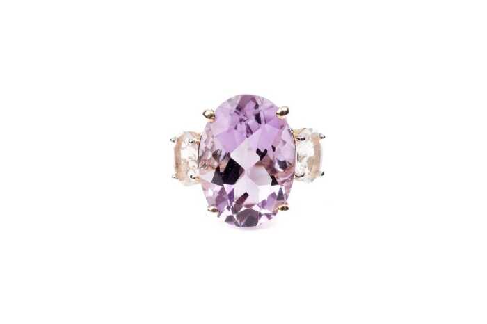 An amethyst and white topaz ring in 9 carat yellow gold