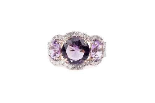 An amethyst and diamond ring in 14 carat yellow gold