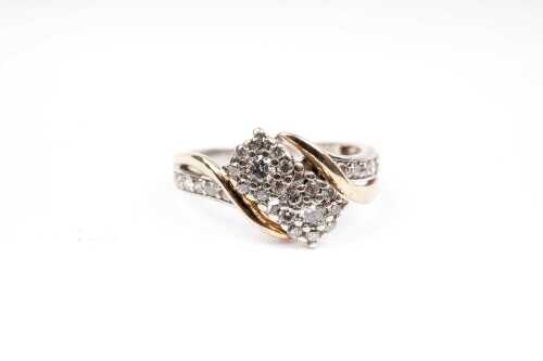 A diamond ring in 10 carat yellow gold