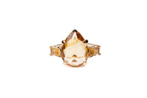 A citrine and diamond ring in 9 carat yellow gold