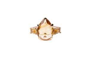 A citrine and diamond ring in 9 carat yellow gold