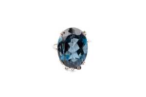 A London blue topaz and diamond ring in 9 carat yellow gold