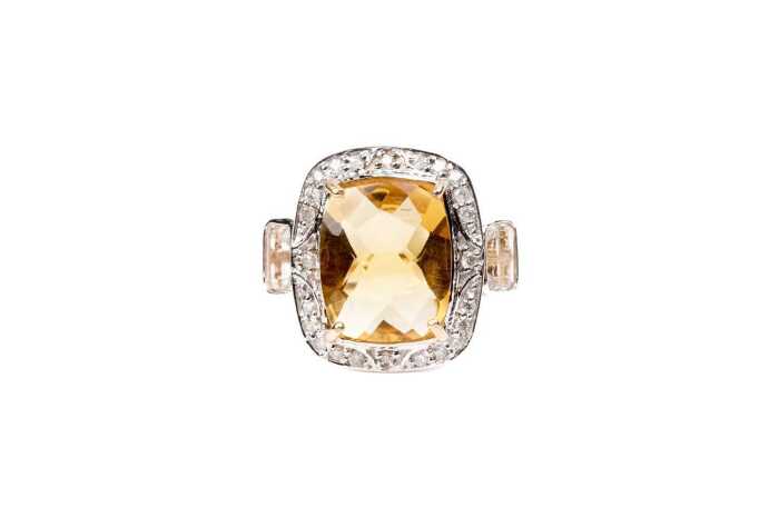 A citrine, white topaz and diamond ring in 9 carat yellow gold
