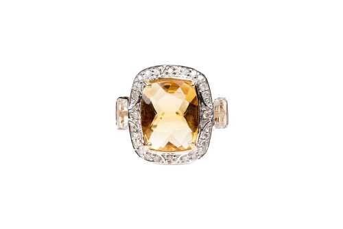 A citrine, white topaz and diamond ring in 9 carat yellow gold