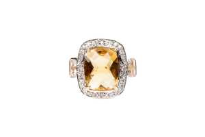 A citrine, white topaz and diamond ring in 9 carat yellow gold