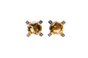 A pair of citrine and diamond earrings in 9 carat yellow gold