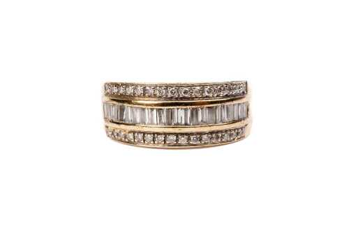A diamond ring in 9 carat yellow gold