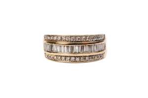 A diamond ring in 9 carat yellow gold
