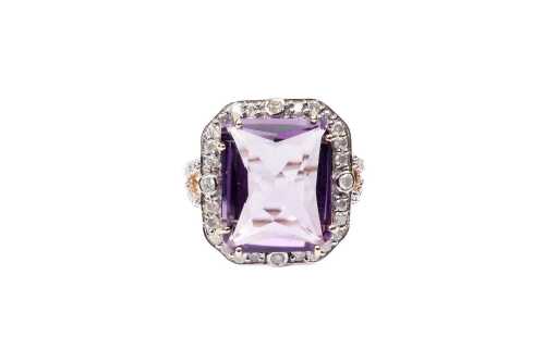 An amethyst and diamond ring in 14 carat yellow gold