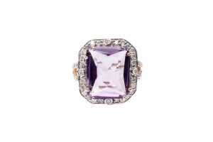 An amethyst and diamond ring in 14 carat yellow gold