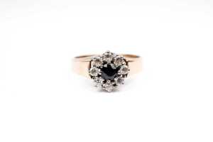 A sapphire and cubic zirconia ring in 9 carat yellow gold