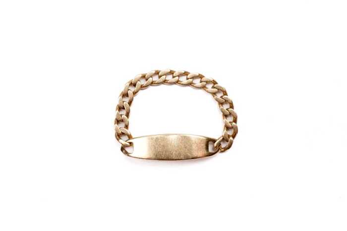 An ID ring in 14 carat yellow gold